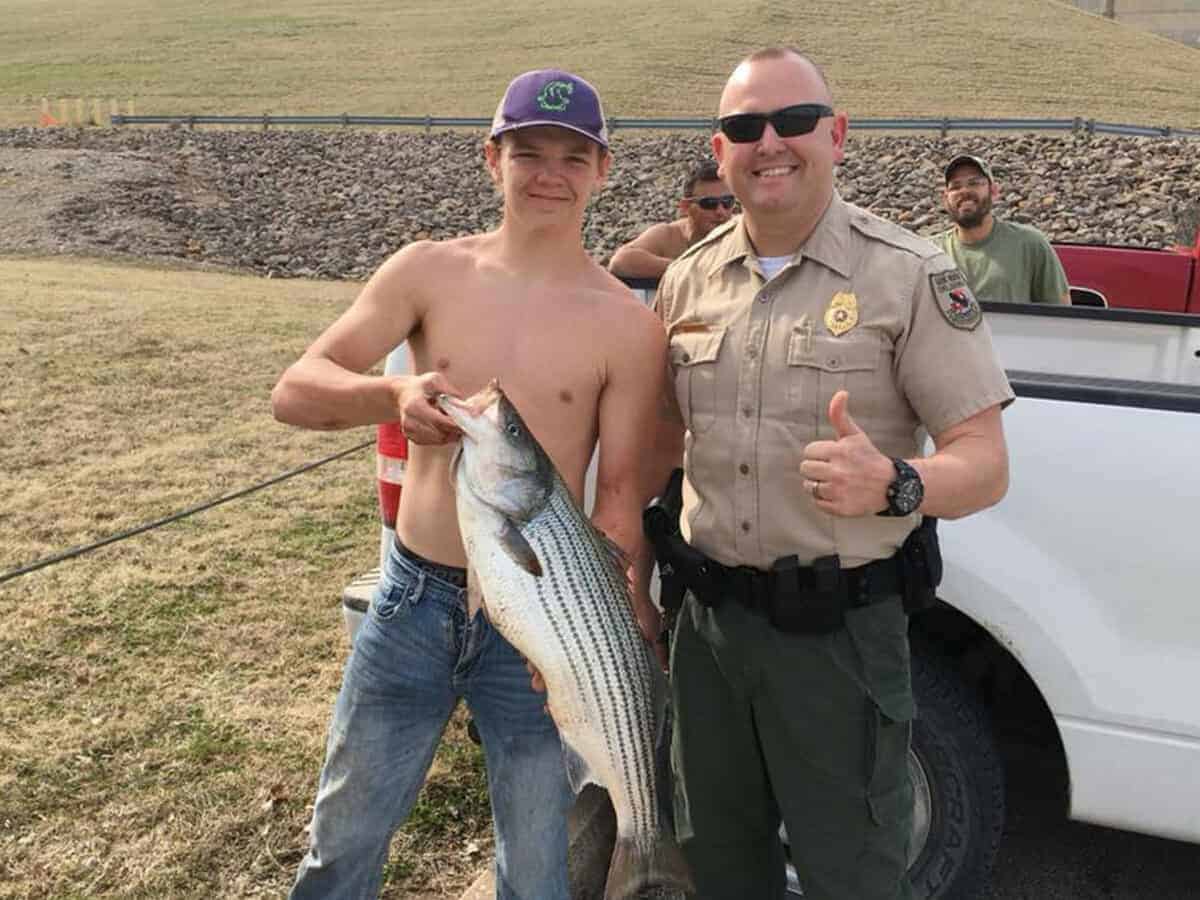 Game warden with fisherman